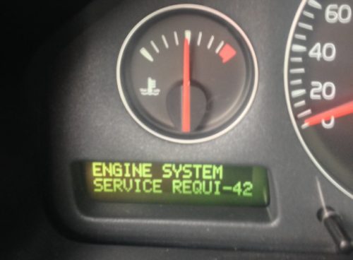 The instrument panel of the car Volvo. A lighted Service lamp indicates the need for a diagnosis
